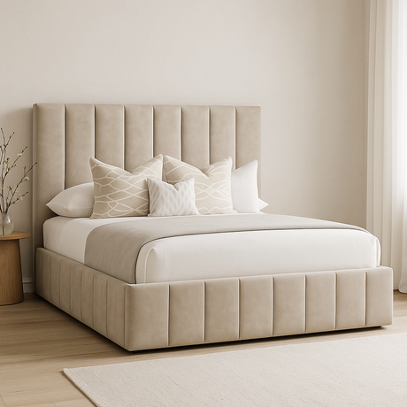 Beige upholstered bed with white bedding and pillows in a bedroom setting.